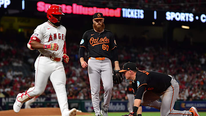 May 10, 2025; Anaheim, California, USA; Baltimore Orioles first baseman Ryan Mountcastle (6) tags first for the out against Los Angeles Angels second baseman Luis Rengifo (2) during the fifth inning at Angel Stadium. Mandatory Credit: Gary A. Vasquez-Imagn Images
