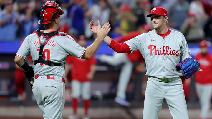 Sep 20, 2024; New York City, New York, USA; Philadelphia Phillies relief pitcher Jeff Hoffman (23) and catcher J.T. Realmuto (10) celebrate after defeating the New York Mets at Citi Field.