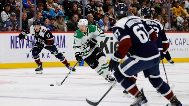 Jan 18, 2025; Denver, Colorado, USA; Dallas Stars center Logan Stankoven (11) controls the puck against left wing Jere Innala (22) and defenseman Keaton Middleton (67) and center Parker Kelly (17) in the third period at Ball Arena. Mandatory Credit: Isaiah J. Downing-Imagn Images