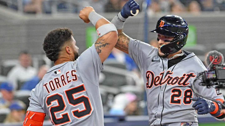May 16, 2025; Toronto, Ontario, CAN;  Detroit Tigers center fielder Javier Baez (28) is greeted by second baseman Gleyber Torres (25) after hitting a solo home run against the Toronto Blue Jays in the eighth inning at Rogers Centre. 