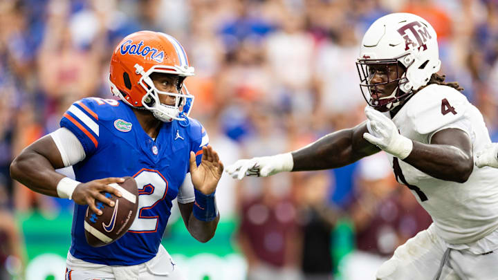 Sep 14, 2024; Gainesville, Florida, USA; Florida Gators quarterback DJ Lagway (2) evades Texas A&M Aggies defensive lineman Shemar Stewart (4) during the first half at Ben Hill Griffin Stadium. Mandatory Credit: Matt Pendleton-Imagn Images