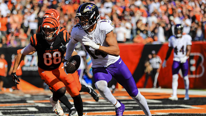 Oct 6, 2024; Cincinnati, Ohio, USA; Baltimore Ravens safety Kyle Hamilton (14) runs with the ball against Cincinnati Bengals tight end Mike Gesicki (88) in the first half at Paycor Stadium. Mandatory Credit: Katie Stratman-Imagn Images Oct 6, 2024; Cincinnati, Ohio, USA; Baltimore Ravens safety Kyle Hamilton (14) runs with the ball against Cincinnati Bengals tight end Mike Gesicki (88) in the first half at Paycor Stadium. Mandatory Credit: Katie Stratman-Imagn Images