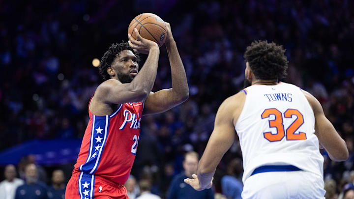 Nov 12, 2024; Philadelphia, Pennsylvania, USA; Philadelphia 76ers center Joel Embiid (21) shoots the ball in front of New York Knicks center Karl-Anthony Towns (32) during the third quarter at Wells Fargo Center. Mandatory Credit: Bill Streicher-Imagn Images