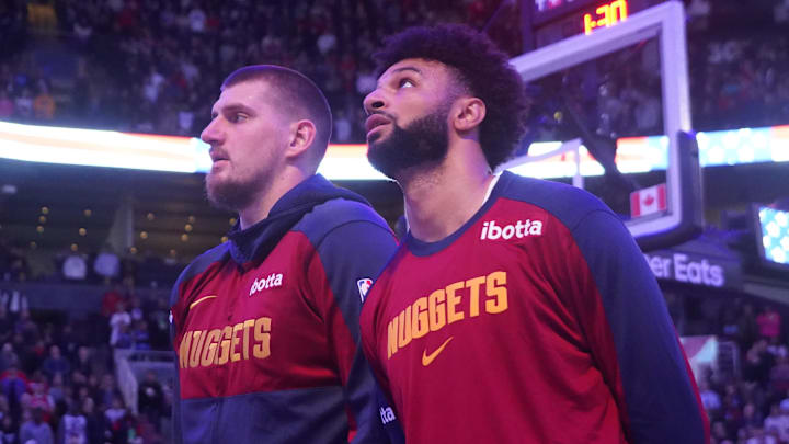 Denver Nuggets center Nikola Jokic (left) and guard Jamal Murray (right) during the anthems before a game against the Toronto Raptors at Scotiabank Arena. Mandatory Credit: John E. Sokolowski-Imagn Images Denver Nuggets center Nikola Jokic (left) and guard Jamal Murray (right) during the anthems before a game against the Toronto Raptors at Scotiabank Arena. Mandatory Credit: John E. Sokolowski-Imagn Images