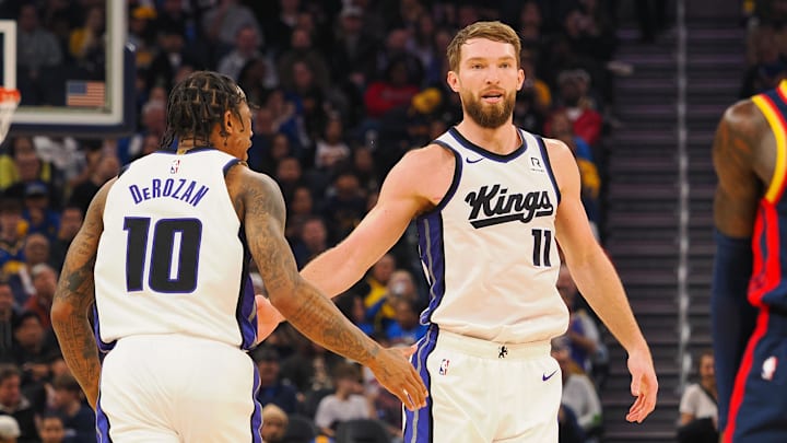 Jan 5, 2025; San Francisco, California, USA; Sacramento Kings center Domantas Sabonis (11) high fives forward/guard DeMar DeRozan (10) after scoring a basket against the Golden State Warriors during the second quarter at Chase Center. Mandatory Credit: Kelley L Cox-Imagn Images Jan 5, 2025; San Francisco, California, USA; Sacramento Kings center Domantas Sabonis (11) high fives forward/guard DeMar DeRozan (10) after scoring a basket against the Golden State Warriors during the second quarter at Chase Center. Mandatory Credit: Kelley L Cox-Imagn Images