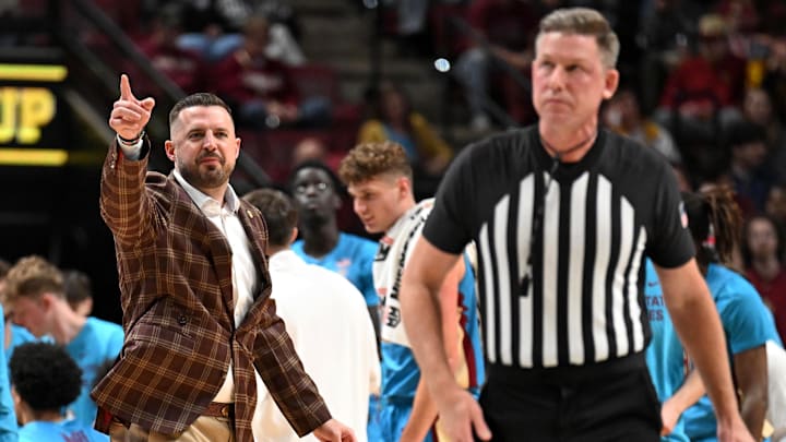 Feb 24, 2026; Tallahassee, Florida, USA; Florida State Seminoles head coach Luke Loucks exchanges words with a referee during the first half against the Miami Hurricanes at Donald L. Tucker Center. Mandatory Credit: Melina Myers-Imagn Images
