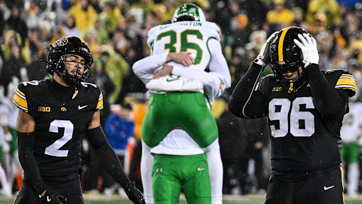 Nov 8, 2025; Iowa City, Iowa, USA; Iowa Hawkeyes defensive back TJ Hall (2) and defensive lineman Bryce Hawthorne (96) react after Oregon Ducks kicker Atticus Sappington (36) kicks the game winning field near the end of the fourth quarter at Kinnick Stadium. Mandatory Credit: Jeffrey Becker-Imagn Images
