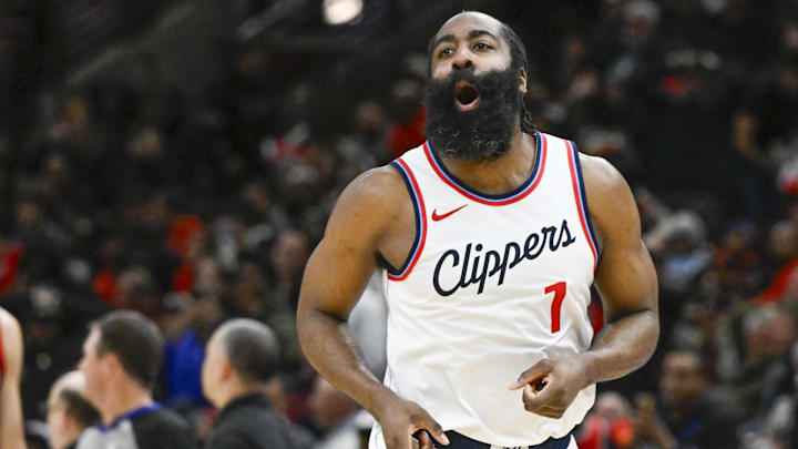 Feb 26, 2025; Chicago, Illinois, USA;  LA Clippers guard James Harden (1) looks towards former Chicago Bulls player Pat Beverley, who was on the sidelines, after scoring against the Chicago Bulls during the second half  at the United Center. Mandatory Credit: Matt Marton-Imagn Images