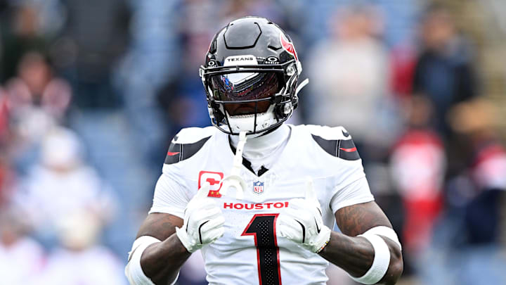 Oct 13, 2024; Foxborough, Massachusetts, USA; Houston Texans wide receiver Stefon Diggs (1) reacts before a game against the New England Patriots at Gillette Stadium. Mandatory Credit: Brian Fluharty-Imagn Images
