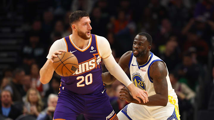Dec 12, 2023; Phoenix, Arizona, USA; Golden State Warriors forward Draymond Green (23) defends against Phoenix Suns center Jusuf Nurkic (20) at Footprint Center. Dec 12, 2023; Phoenix, Arizona, USA; Golden State Warriors forward Draymond Green (23) defends against Phoenix Suns center Jusuf Nurkic (20) at Footprint Center.