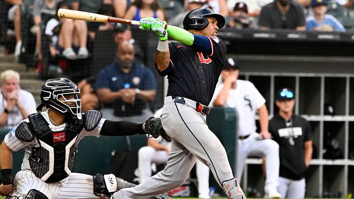 Aug 9, 2026; Chicago, Illinois, USA;  Cleveland Guardians third baseman José Ramírez (11) hits an RBI sacrifice fly ball during the ninth inning against the Chicago White Sox at Rate Field. Mandatory Credit: Matt Marton-Imagn Images