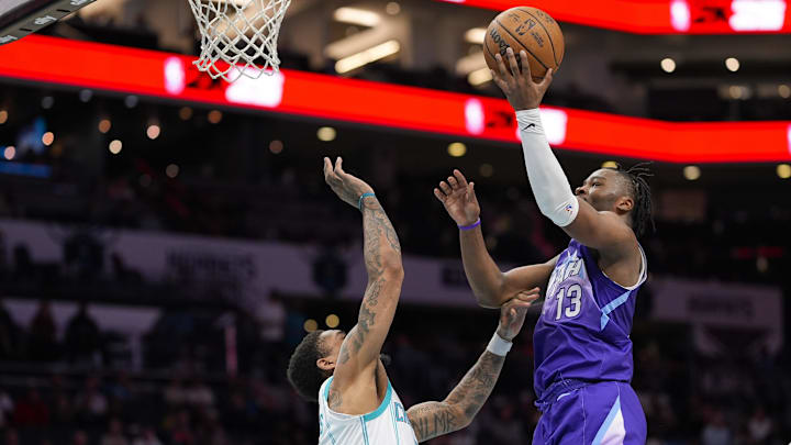 Mar 31, 2025; Charlotte, North Carolina, USA; Utah Jazz guard Isaiah Collier (13) goes to the basket against Charlotte Hornets guard DaQuan Jeffries (3) during the second half at Spectrum Center. Mandatory Credit: Jim Dedmon-Imagn Images Mar 31, 2025; Charlotte, North Carolina, USA; Utah Jazz guard Isaiah Collier (13) goes to the basket against Charlotte Hornets guard DaQuan Jeffries (3) during the second half at Spectrum Center. Mandatory Credit: Jim Dedmon-Imagn Images