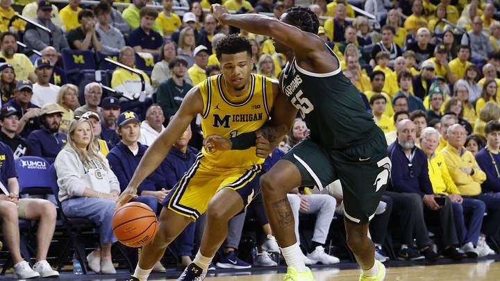 Mar 8, 2026; Ann Arbor, Michigan, USA; Michigan Wolverines guard Trey McKenney (1) dribbles defended by Michigan State Spartans forward Coen Carr (55) in the first half at Crisler Center. Mandatory Credit: Rick Osentoski-Imagn Images Mar 8, 2026; Ann Arbor, Michigan, USA; Michigan Wolverines guard Trey McKenney (1) dribbles defended by Michigan State Spartans forward Coen Carr (55) in the first half at Crisler Center. Mandatory Credit: Rick Osentoski-Imagn Images