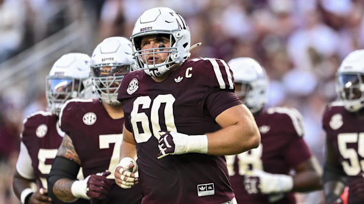 Texas A&M Aggies offensive lineman Trey Zuhn III (60) and the offense run onto the field in the first half against the Florida Gators at Kyle Field. Texas A&M Aggies offensive lineman Trey Zuhn III (60) and the offense run onto the field in the first half against the Florida Gators at Kyle Field.