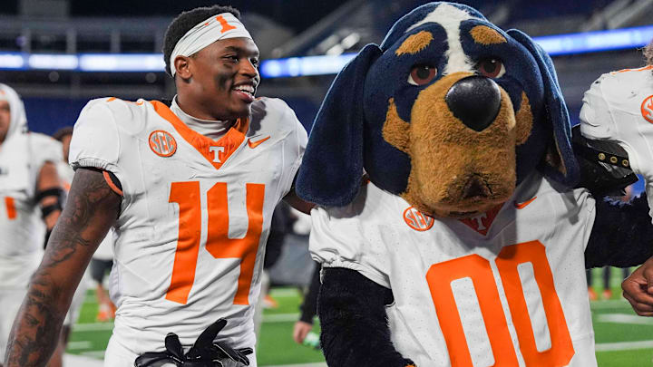 Tennessee wide receiver Braylon Staley (14) smiles as he stands next to Smokey after winning a NCAA football game against Kentucky at Kroger Field in Lexington, Kentucky on Oct. 25, 2025. Tennessee wide receiver Braylon Staley (14) smiles as he stands next to Smokey after winning a NCAA football game against Kentucky at Kroger Field in Lexington, Kentucky on Oct. 25, 2025.