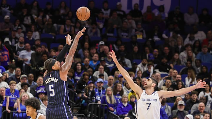 Orlando Magic forward Paolo Banchero (5) shoots over Memphis Grizzlies forward Santi Aldama (7) during the second half at Kia Center.