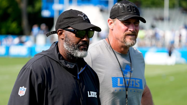 Detroit Lions executive vice president and general manager Brad Holmes, left, and Lions head coach Dan Campbell head off the practice field at the team's training facility in Allen Park on Wednesday, Aug. 14, 2024.