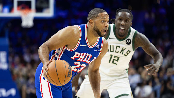 Oct 23, 2024; Philadelphia, Pennsylvania, USA; Philadelphia 76ers guard Eric Gordon (23) dribbles in front of Milwaukee Bucks forward Taurean Prince (12) during the fourth quarter at Wells Fargo Center. Mandatory Credit: Bill Streicher-Imagn Images