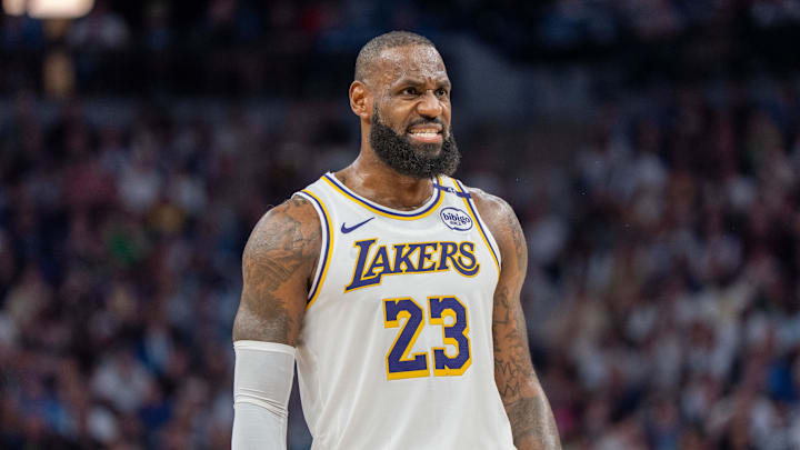 Apr 27, 2025; Minneapolis, Minnesota, USA; Los Angeles Lakers forward LeBron James (23) talks with a referee in the third quarter against the Minnesota Timberwolves during game four of first round for the 2025 NBA Playoffs at Target Center. Mandatory Credit: Matt Blewett-Imagn Images