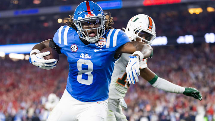Jan 8, 2026; Glendale, AZ, USA; Mississippi Rebels tight end Dae'Quan Wright (8) scores a touchdown against the Miami Hurricanes during the 2026 Fiesta Bowl and semifinal game of the College Football Playoff at State Farm Stadium. Mandatory Credit: Mark J. Rebilas-Imagn Images