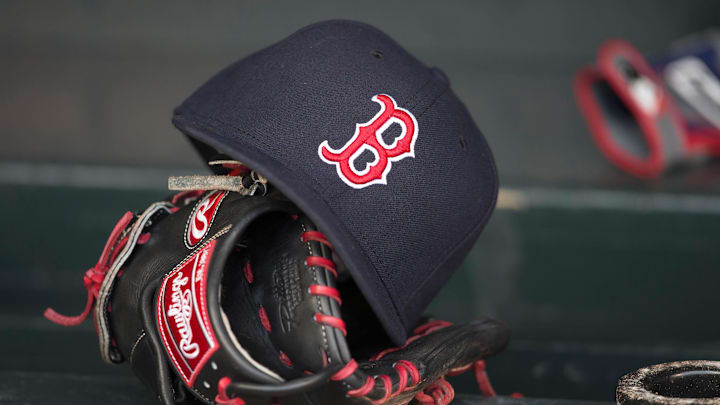 May 14, 2014; Minneapolis, MN, USA; A general view of a glove and Boston Red Sox hat in the dugout prior to a game between the Boston Red Sox and Minnesota Twins at Target Field. Mandatory Credit: Jesse Johnson-Imagn Images