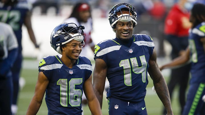 Nov 1, 2020; Seattle, Washington, USA; Seattle Seahawks wide receiver Tyler Lockett (16) and wide receiver DK Metcalf (14) return to the locker room following a 37-27 victory against the San Francisco 49ers at CenturyLink Field. Mandatory Credit: Joe Nicholson-Imagn Images