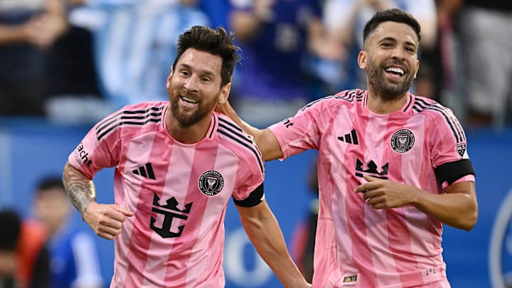 Inter Miami CF players Lionel Messi and Jordi Alba celebrate Saturday after one of Messi's two goals against CF Montreal.