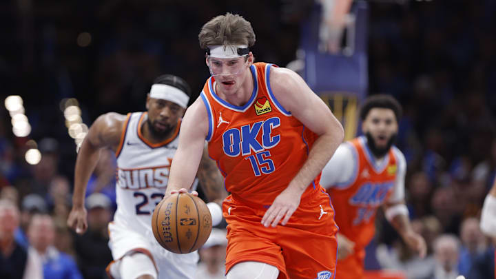 Oklahoma City Thunder center Branden Carlson (15) recovers a loose ball during a play against the Phoenix Suns during the second half at Paycom Center. Mandatory Credit: Alonzo Adams-Imagn Images Oklahoma City Thunder center Branden Carlson (15) recovers a loose ball during a play against the Phoenix Suns during the second half at Paycom Center. Mandatory Credit: Alonzo Adams-Imagn Images