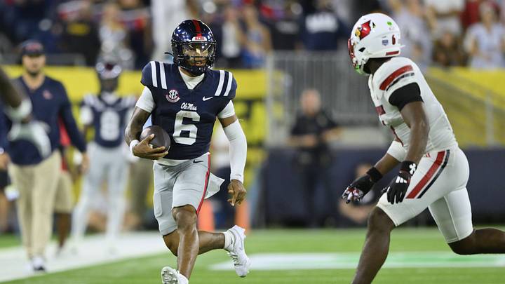 Sep 6, 2026; Nashville, Tennessee, USA; Mississippi Rebels quarterback Trinidad Chambliss (6) carries the ball against the Louisville Cardinals during the fourth quarter at Nissan Stadium. Mandatory Credit: Steve Roberts-Imagn Images Sep 6, 2026; Nashville, Tennessee, USA; Mississippi Rebels quarterback Trinidad Chambliss (6) carries the ball against the Louisville Cardinals during the fourth quarter at Nissan Stadium. Mandatory Credit: Steve Roberts-Imagn Images