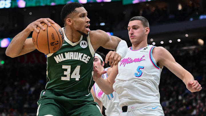 Jan 23, 2025; Milwaukee, Wisconsin, USA; Milwaukee Bucks forward Giannis Antetokounmpo (34) looks for a shot against Miami Heat forward Nikola Jovic (5) in the fourth quarter at Fiserv Forum. Mandatory Credit: Benny Sieu-Imagn Images