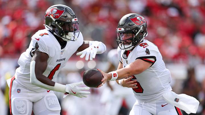 Tampa Bay Buccaneers quarterback Baker Mayfield (6) hands off to running back Rachaad White. Tampa Bay Buccaneers quarterback Baker Mayfield (6) hands off to running back Rachaad White.