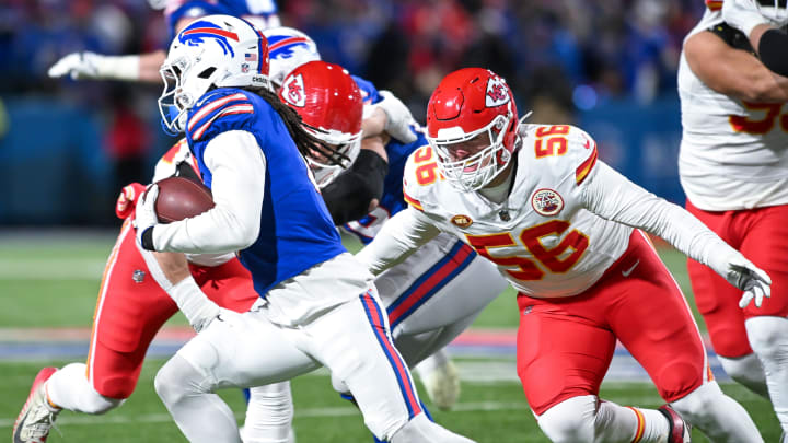 Jan 21, 2024; Orchard Park, New York, USA;Kansas City Chiefs defensive end George Karlaftis (56) and Buffalo Bills running back James Cook (4)  in the first half of a 2024 AFC divisional round game at Highmark Stadium. Mandatory Credit: Mark Konezny-USA TODAY Sports