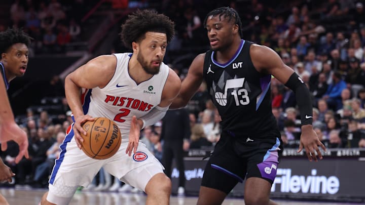 Mar 3, 2025; Salt Lake City, Utah, USA; Detroit Pistons guard Cade Cunningham (2) drives to the basket against Utah Jazz guard Isaiah Collier (13) during the first half at Delta Center. Mandatory Credit: Rob Gray-Imagn Images