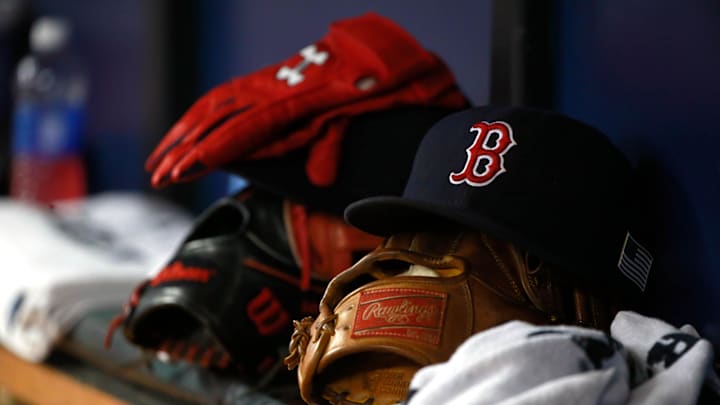 Sep 11, 2015; St. Petersburg, FL, USA; Boston Red Sox hat and gloves lay in the dugout at Tropicana Field. Mandatory Credit: Kim Klement-Imagn Images
