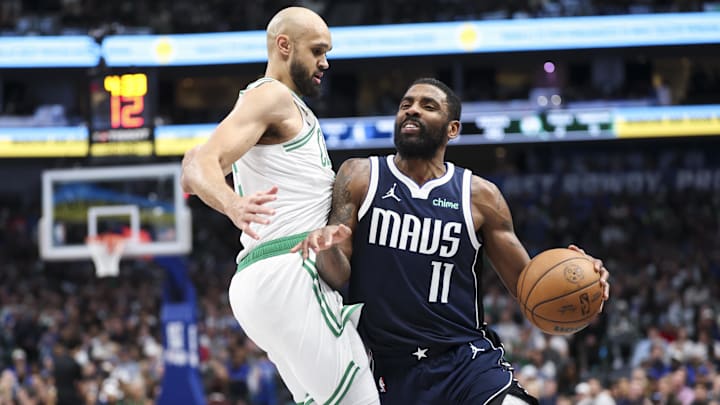Jan 25, 2025; Dallas, Texas, USA;  Dallas Mavericks guard Kyrie Irving (11) drives to the basket as Boston Celtics guard Derrick White (9) defends during the first half at American Airlines Center. Mandatory Credit: Kevin Jairaj-Imagn Images