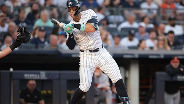 Jun 18, 2024; Bronx, New York, USA; New York Yankees center fielder Aaron Judge (99) is hit by a pitch during the third inning against the Baltimore Orioles at Yankee Stadium. Mandatory Credit: Vincent Carchietta-USA TODAY Sports