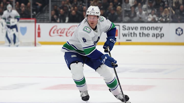 Feb 26, 2025; Los Angeles, California, USA; Vancouver Canucks right wing Brock Boeser (6) skates with the puck during the third period against the Los Angeles Kings at Crypto.com Arena. Mandatory Credit: Jason Parkhurst-Imagn Images