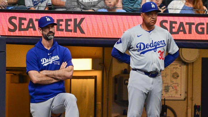 Aug 15, 2024; Milwaukee, Wisconsin, USA; Los Angeles Dodgers manager Dave Roberts (right) and pitching coach Mark Prior look on from the dugout in the seventh inning against the Milwaukee Brewers at American Family Field. Mandatory Credit: Benny Sieu-Imagn Images Aug 15, 2024; Milwaukee, Wisconsin, USA; Los Angeles Dodgers manager Dave Roberts (right) and pitching coach Mark Prior look on from the dugout in the seventh inning against the Milwaukee Brewers at American Family Field. Mandatory Credit: Benny Sieu-Imagn Images