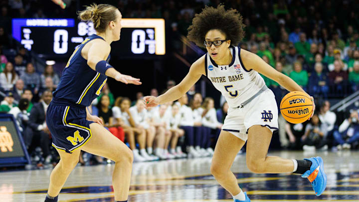 Notre Dame guard Olivia Miles (5) drives to the basket during the second round of the NCAA Women's Basketball Tournament between Notre Dame and Michigan at Purcell Pavilion on Sunday, March 23, 2025, in South Bend. Notre Dame guard Olivia Miles (5) drives to the basket during the second round of the NCAA Women's Basketball Tournament between Notre Dame and Michigan at Purcell Pavilion on Sunday, March 23, 2025, in South Bend.