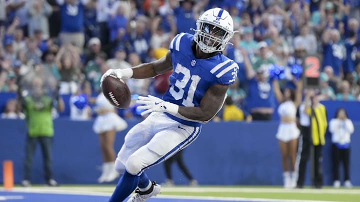 Oct 20, 2024; Indianapolis, Indiana, USA; Indianapolis Colts running back Tyler Goodson (31) rushes into the end zone for his first career touchdown during a game against the Miami Dolphins at Lucas Oil Stadium.