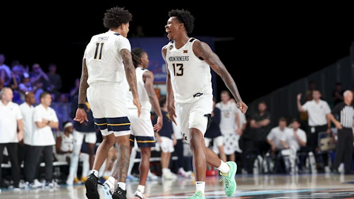 Nov 27, 2024; Paradise Island, Bahamas, BHS; West Virginia Mountaineers forward Amani Hansberry (13) celebrates with West Virginia Mountaineers guard Jonathan Powell (11) during overtime against the Gonzaga Bulldogs at the Atlantis Resort.  Mandatory Credit: Kevin Jairaj-Imagn Images