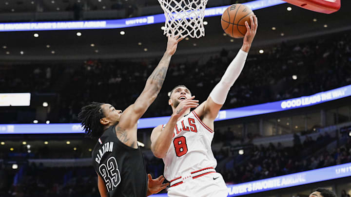 Dec 2, 2024; Chicago, Illinois, USA; Chicago Bulls guard Zach LaVine (8) shoots against Brooklyn Nets center Nic Claxton (33) during the first half at the United Center. Mandatory Credit: Matt Marton-Imagn Images Dec 2, 2024; Chicago, Illinois, USA; Chicago Bulls guard Zach LaVine (8) shoots against Brooklyn Nets center Nic Claxton (33) during the first half at the United Center. Mandatory Credit: Matt Marton-Imagn Images