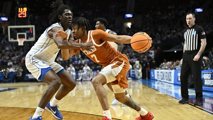 Mar 19, 2026; Portland, OR, USA; Texas Longhorns guard Simeon Wilcher (7) drives against BYU Cougars forward Khadim Mboup (7) in the first half during a first round game of the men's 2026 NCAA Tournament at Moda Center. Mandatory Credit: Craig Strobeck-Imagn Images Mar 19, 2026; Portland, OR, USA; Texas Longhorns guard Simeon Wilcher (7) drives against BYU Cougars forward Khadim Mboup (7) in the first half during a first round game of the men's 2026 NCAA Tournament at Moda Center. Mandatory Credit: Craig Strobeck-Imagn Images