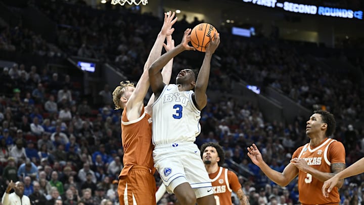 Mar 19, 2026; Portland, OR, USA; BYU Cougars forward AJ Dybantsa (3) shoots against Texas Longhorns center Matas Vokietaitis (8) in the first half during a first round game of the men's 2026 NCAA Tournament at Moda Center. Mandatory Credit: Craig Strobeck-Imagn Images