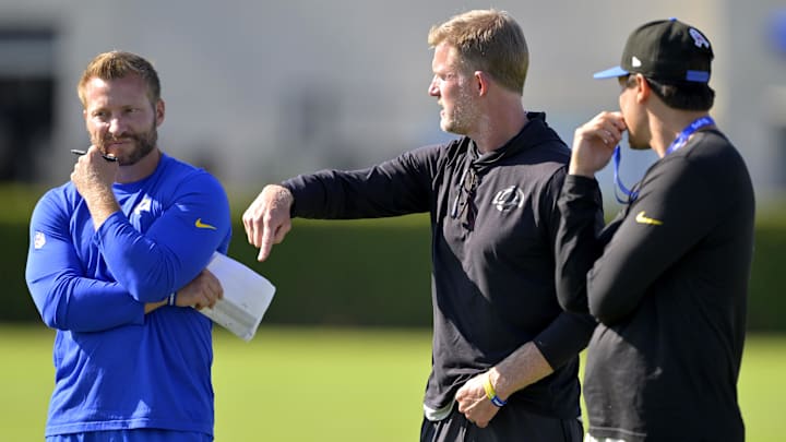 Jul 29, 2024; Los Angeles, CA, USA; Los Angeles Rams head coach Sean McVay, general manager Les Snead, and chief of staff Carter Crutchfield talk on the field during training camp at Loyola Marymount University. Mandatory Credit: Jayne Kamin-Oncea-Imagn Images