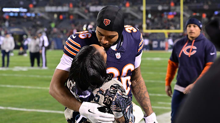 Dec 26, 2024; Chicago, Illinois, USA; United States gymnast Simone Biles greets husband and Chicago Bears defensive back Jonathan Owens (36) before the game against the Seattle Seahawks at Soldier Field. 