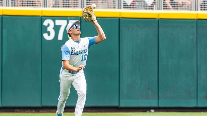Jun 18, 2024; Omaha, NE, USA; North Carolina Tar Heels left fielder Casey Cook (16) makes a catch for an out against the Florida State Seminoles during the sixth inning at Charles Schwab Field Omaha. Mandatory Credit: Dylan Widger-USA TODAY Sports
