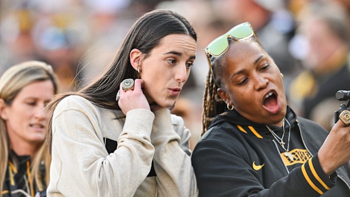 Oct 26, 2024: Former Iowa Hawkeye and current Indiana Fever WNBA star Caitlin Clark reacts with friends and family while being honored.