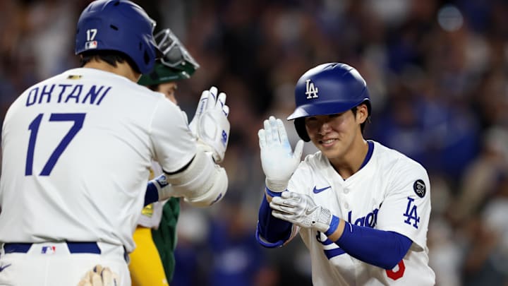 May 14, 2025; Los Angeles, California, USA; Los Angeles Dodgers second baseman Hyeseong Kim (6) celebrates with designated hitter Shohei Ohtani (17) after hitting a home run during the fifth inning against the Athletics at Dodger Stadium. Mandatory Credit: Jason Parkhurst-Imagn Images