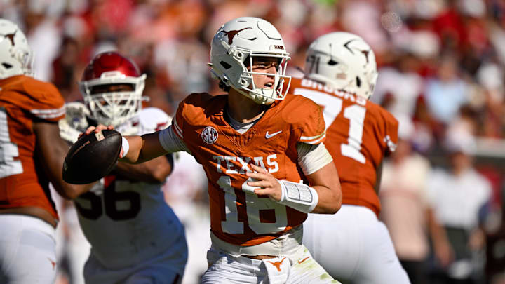 Texas Longhorns quarterback Arch Manning looks to throw the ball during the game between the Texas Longhorns and the Oklahoma Sooners at the Cotton Bowl.